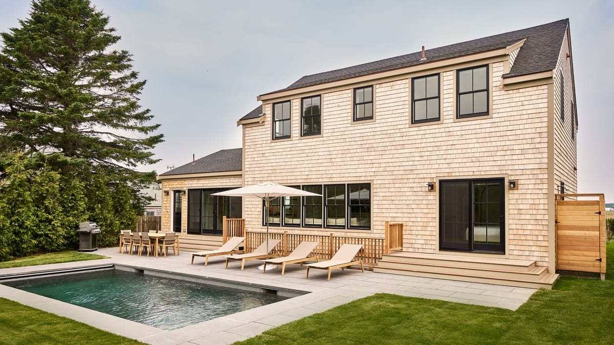 Shingled house with pool and lawn