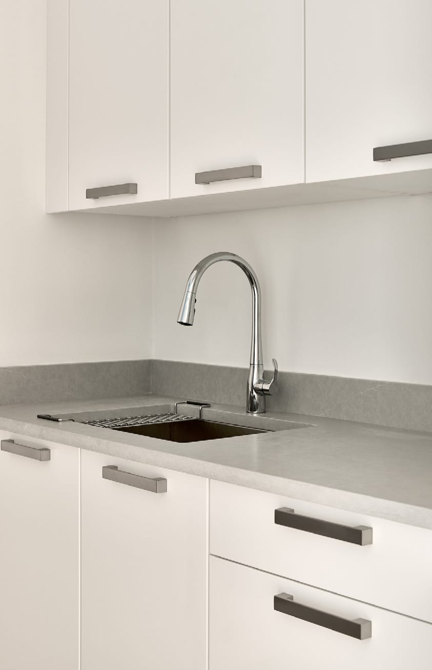 Sink run with white channel handles