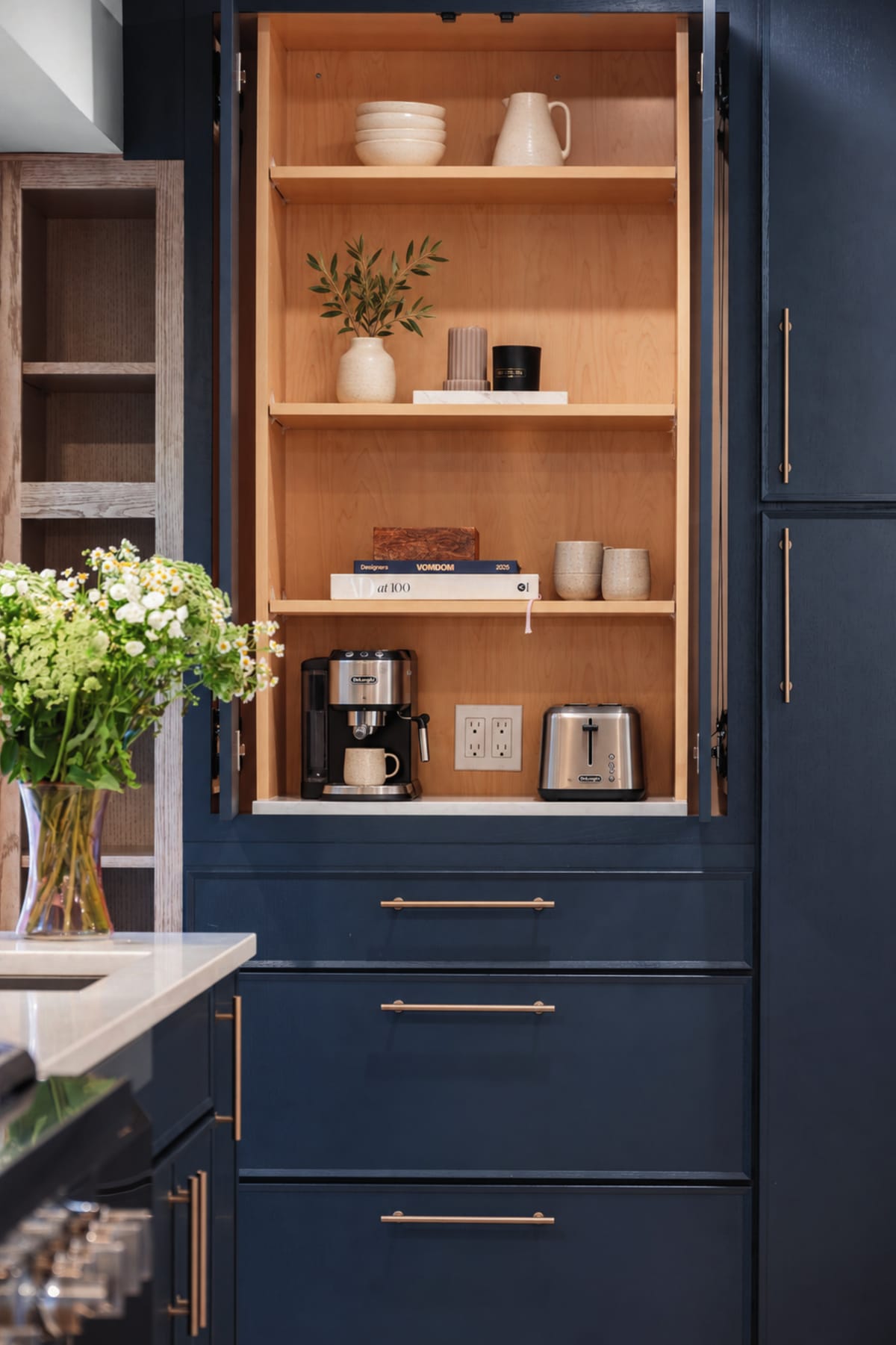 Deep blue pantry cabinet with a wood interior