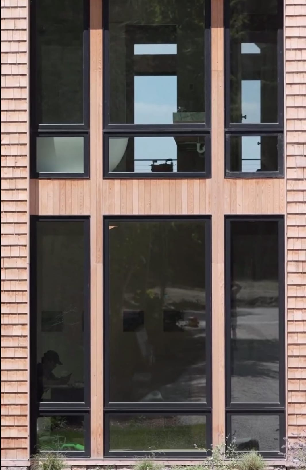 Tall windows in cedar cladding