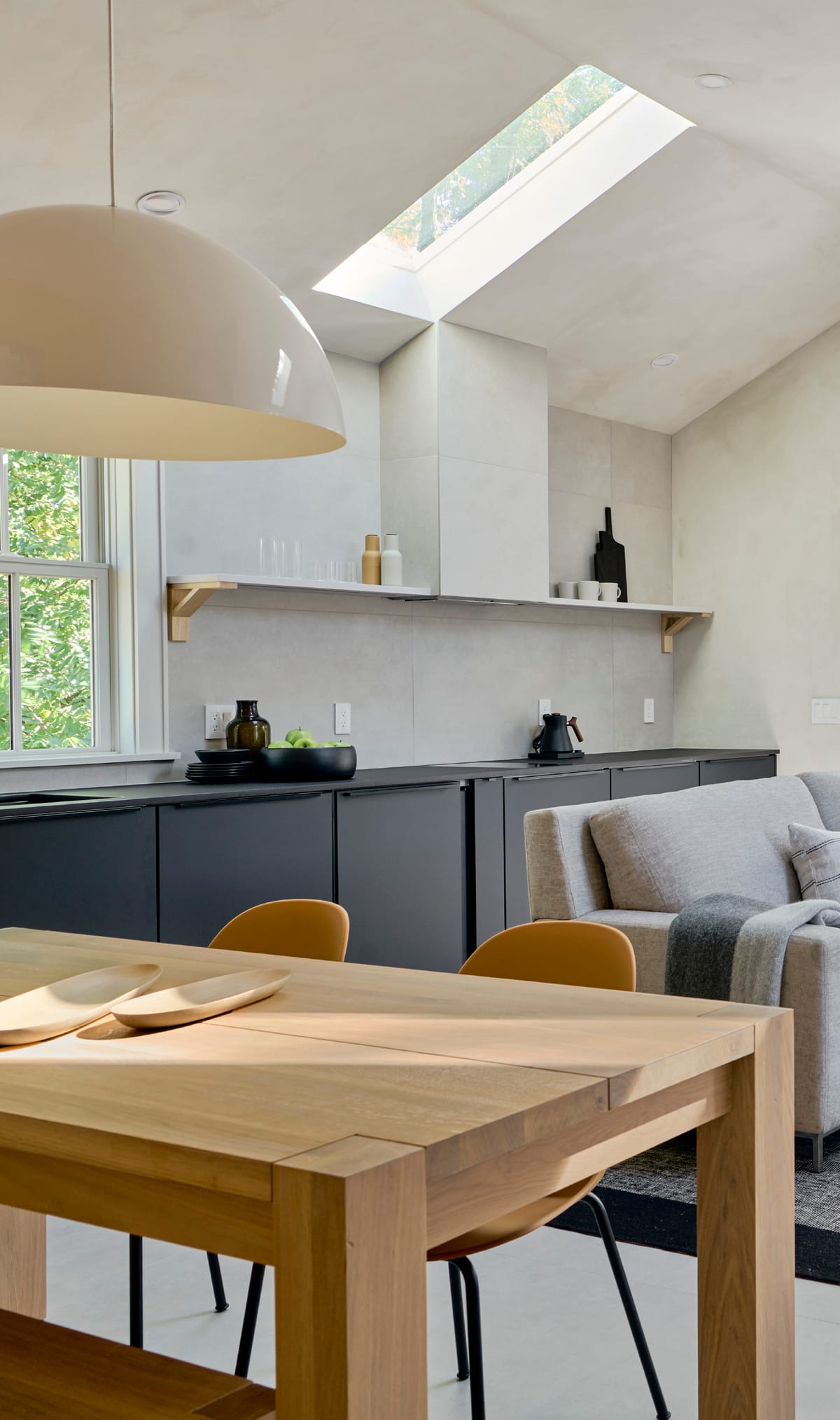 Kitchen with skylight and black cabinetry