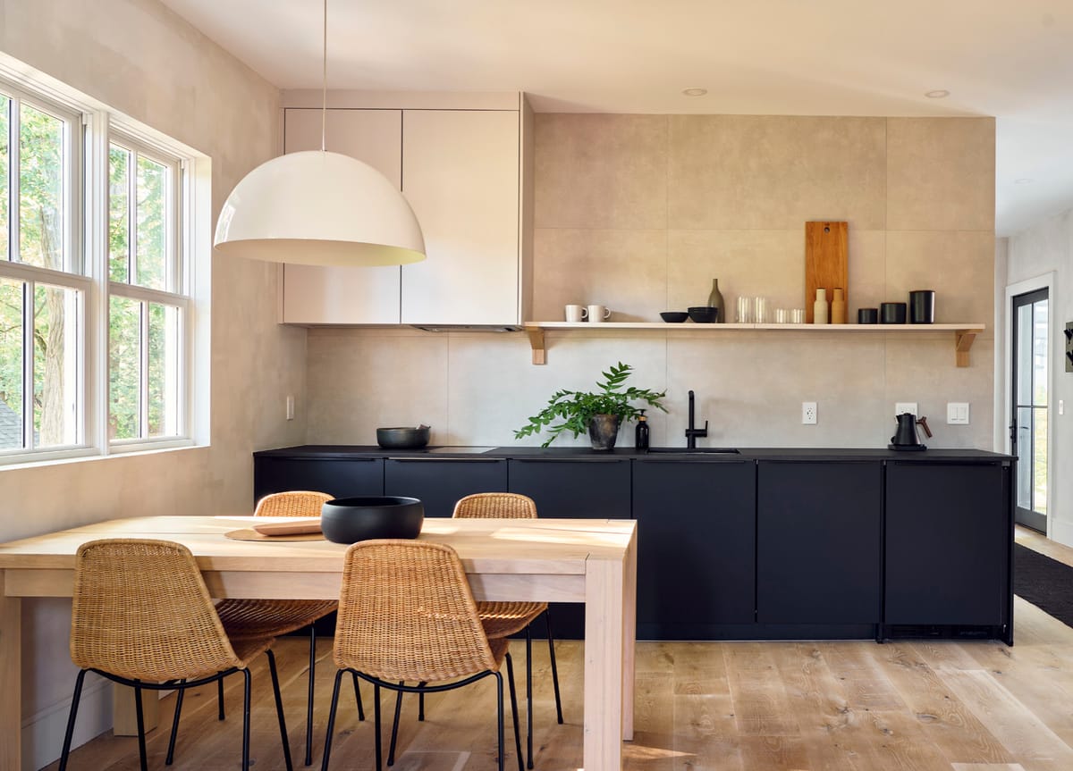 Dining table and black kitchen