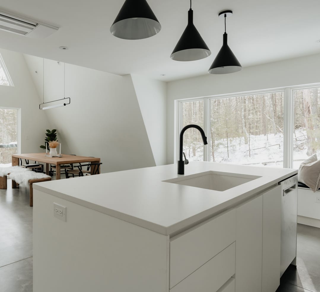 Kitchen island under black pendants